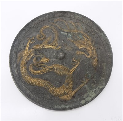 Lot 1165 - A Japanese circular bronze mirror, decorated...