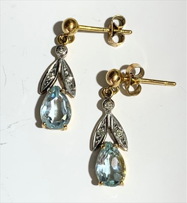 Lot 2493 - A pair of earrings, set with pear shaped...