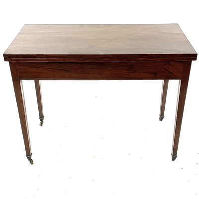 Lot 1925 - A George III mahogany and line inlaid fold-top tea table.