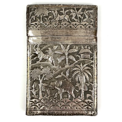Lot 1039 - An Burmese silver card case, decorated with trees and animals