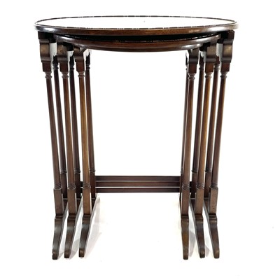 Lot 1897 - An Edwardian mahogany nest of three oval occasional tables.