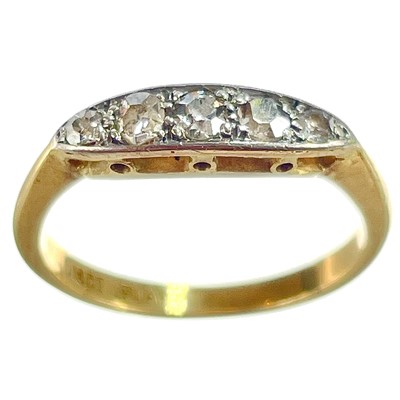 Lot 14 - An 18ct and platinum diamond set five stone ring.