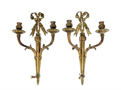 Lot 123 - A pair of bronze twin branch candle sconces.