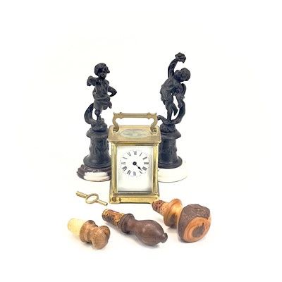 Lot 77 - A pair of bronze figures of cherubs.