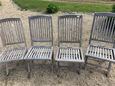 Lot 86 - Four folding teak chairs.