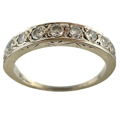 Lot 222 - A modern 18ct white gold diamond set nine stone half eternity ring.