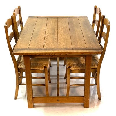 Lot 1888 - An oak rectangular dining table and four ladderback chairs.