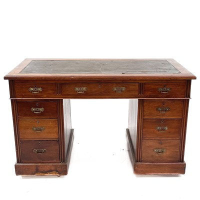 Lot 1893 - A late Victorian walnut kneehole desk.