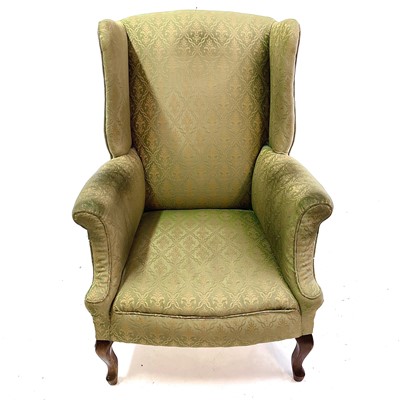 Lot 1899 - An Edwardian walnut framed wing armchair.