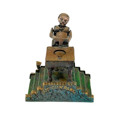 Lot 8 - An American cast iron Magician money bank.