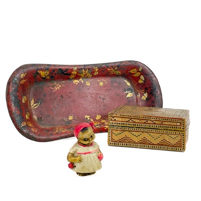 Lot 24 - A celluloid novelty tape measure modelled as a young girl.
