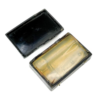 Lot 42 - A French pressed horn pocket music box.