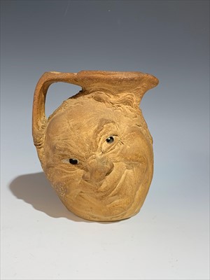 Lot 1383 - A Martin Brothers stoneware jug modelled with...