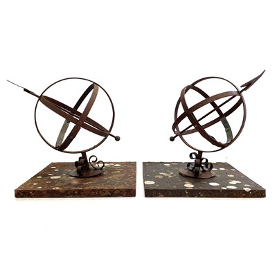 Lot 605 - A pair of wrought iron and brass mounted armillary spheres.