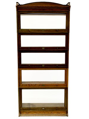 Lot 1903 - A Lebus oak sectional bookcase.