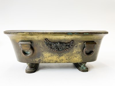 Lot 60 - A gilt bronze Regency grand tour inkstand of sarcophagus form.