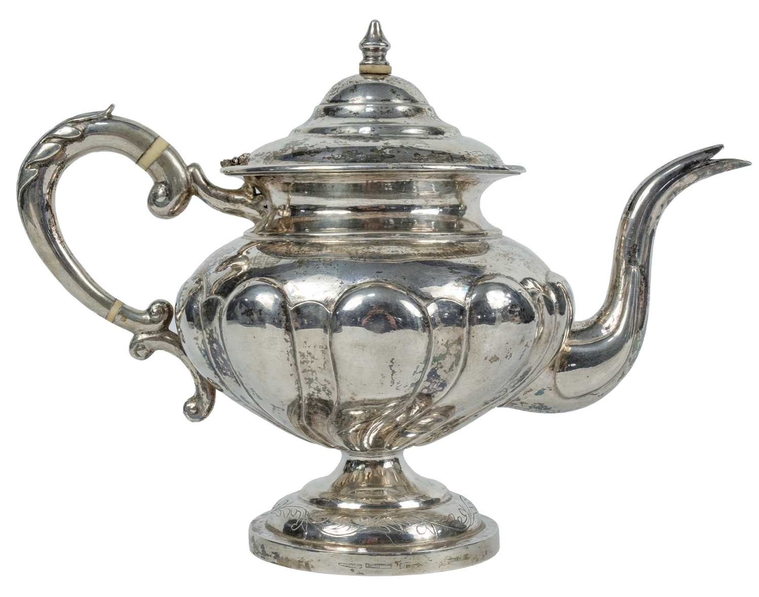 Lot 7 - A Chinese silver teapot, circa 1900.