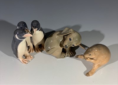 Lot 1390 - Three Royal Copenhagen ornaments - penguin...