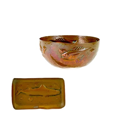 Lot 13 - A small Newlyn hammered copper bowl with repousse fish decoration.
