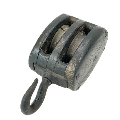 Lot 53 - A black stained oak ship's block.