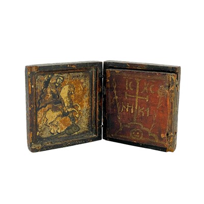 Lot 153 - A small treen orthodox painted triptych portable travel icon.
