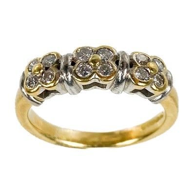 Lot 262 - A modern 18ct bi-colour gold and diamond set twelve stone ring.