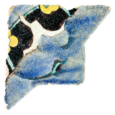 Lot 105 - An early Persian tile fragment, Isfahan, probably 12th century.