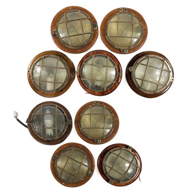 Lot 478 - A collection of nine bulkhead lights.