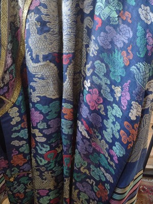 Lot 47 - A Chinese silk embroidered dragon robe, early 20th century.