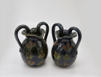 Lot 1408 - A pair of 20th century twin handled vases with...