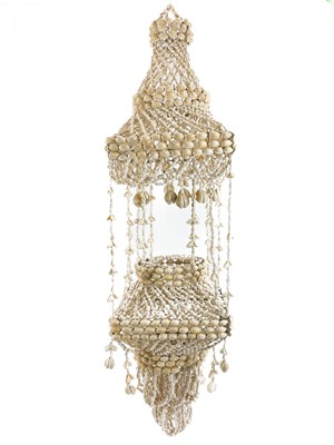 Lot 39 - A cowrie shell plant holder circa 1970