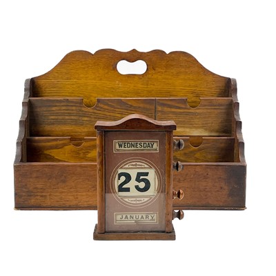 Lot 84 - An early 20th century desk calendar.