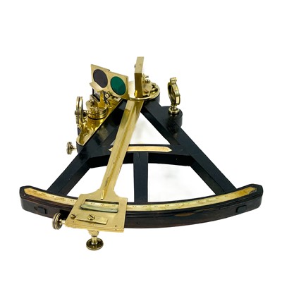 Lot 445 - An early 19th century Macassar ebony octant with brass mounts.