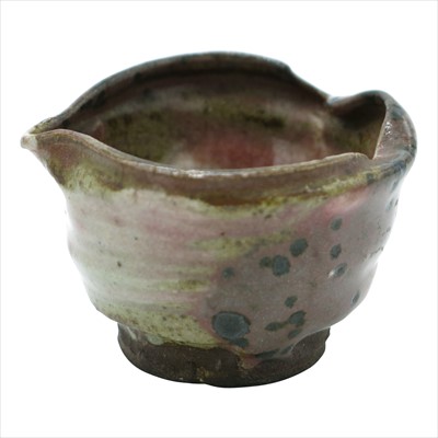 Lot 1179 - A small Japanese pottery spouted bowl, 19th...