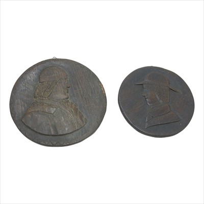 Lot 247 - Two circular oak naive portrait roundels,...