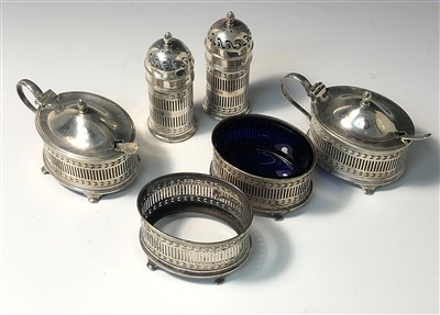 Lot 2022 - A 1920's pierced silver cruet comprising two...