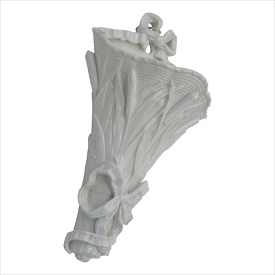 Lot 1411 - A white pottery wall pocket, decorated with...