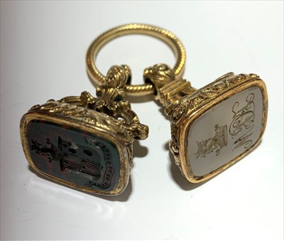 Lot 2542 - Two seals and a split ring.