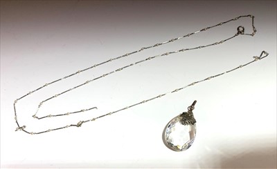 Lot 2540 - A fine white metal long chain spaced with...