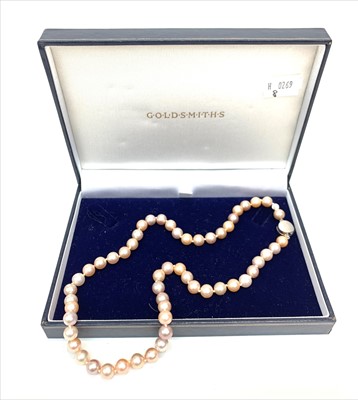 Lot 2422 - A string of 55 pink tinted Schoeffel pearls...