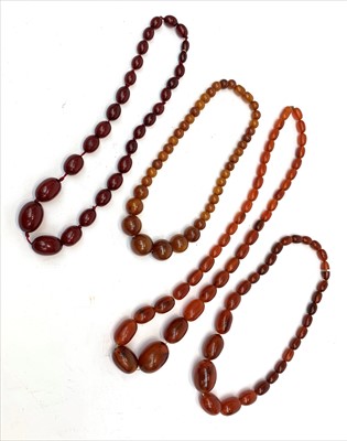 Lot 2423 - Four "amber" necklaces.