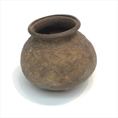 Lot 1494 - A pottery bowl, possibly bronze age, with...