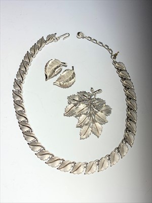 Lot 2630 - A Trifari leaf necklace and matching brooch and earrings.