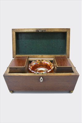 Lot 267 - A Regency mahogany tea caddy of sarcophagus...