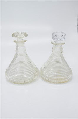 Lot 1426 - A pair of step cut circular ship's decanters,...