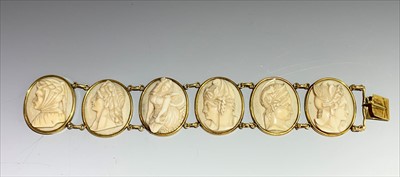 Lot 2444 - A gold mounted cameo bracelet the six ivory...
