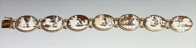 Lot 2445 - A cameo chariot bracelet with seven gold...