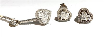Lot 2448 - An 18ct. white gold diamond set heart pendant...