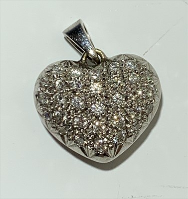 Lot 2455 - A diamond set bow pendant necklace.