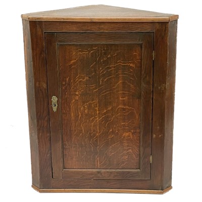 Lot 1876 - A 19th century oak corner cupboard.